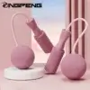 Minimalist pink wireless jump rope with soft ergonomic handles, designed for compact indoor workouts and clean girl fitness routines.